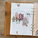 Page de daily journal de Noël créée avec transferts stickers Joyeux Noël et illustrations de village enneigé
