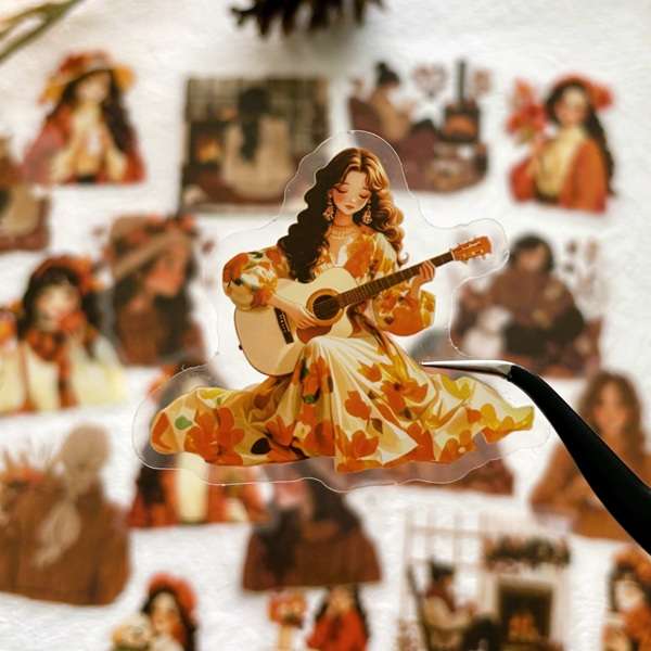 Sticker PET illustrant une jeune femme jouant de la guitare, vêtue d'une robe fleurie aux couleurs chaudes de l'automne.